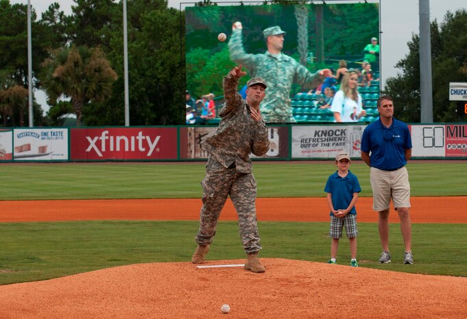 Maj. Nathan Molica, US Army Corps of Engineers- Charleston deputy commander, delivers the ceremonial first pitch during Military Appreciation Night July 19, 2014, at Joseph P. Riley Jr. ballpark in Charleston, S.C. The Charleston RiverDogs hosted Military Appreciation Night to show their support for the local military. (U.S. Air Force photo/ Staff Sgt. William A. O’Brien)
