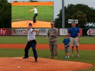 Lt. Col. Dale Skinner, 628th Contracting Squadron commander, delivers the ceremonial first pitch during Military Appreciation Night July 19, 2014, at Joseph P. Riley Jr. ballpark in Charleston, S.C. The Charleston RiverDogs hosted Military Appreciation Night to show their support for the local military. (U.S. Air Force photo/ Staff Sgt. William A. O’Brien)