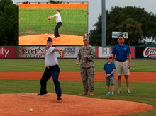 Lt. Col. Dale Skinner, 628th Contracting Squadron commander, delivers the ceremonial first pitch during Military Appreciation Night July 19, 2014, at Joseph P. Riley Jr. ballpark in Charleston, S.C. The Charleston RiverDogs hosted Military Appreciation Night to show their support for the local military. (U.S. Air Force photo/ Staff Sgt. William A. O’Brien)