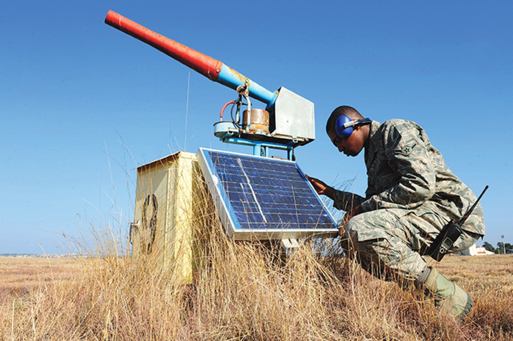 BASH programs developed at Kirtland’s Air Force Safety Center are used at airfields around the world to reduce the chances of bird strikes, which pose a safety hazard. One method to scare birds is through a Bird Aircraft Strike Hazard cannon, like the one seen here being inspected by Airman Warren Washington,  39th Operations
Squadron airfield management operations coordinator. (Courtesy photo)