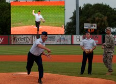 Chief Master Sgt. David Wade, 437th Maintenance Group superintendent, delivers a ceremonial first pitch during Military Appreciation Night July 19, 2014, at Joseph P. Riley Jr. ballpark in Charleston, S.C. The Charleston RiverDogs hosted Military Appreciation Night to show their support for the local military. (U.S. Air Force photo/ Staff Sgt. William A. O’Brien)