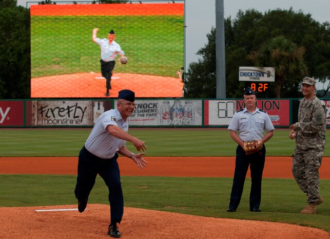 Chief Master Sgt. David Wade, 437th Maintenance Group superintendent, delivers a ceremonial first pitch during Military Appreciation Night July 19, 2014, at Joseph P. Riley Jr. ballpark in Charleston, S.C. The Charleston RiverDogs hosted Military Appreciation Night to show their support for the local military. (U.S. Air Force photo/ Staff Sgt. William A. O’Brien)