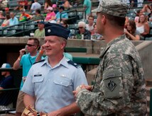Lt. Col. Dale Skinner, 628th Contracting Squadron commander, prepares to throw his first-ever ceremonial first pitch during Military Appreciation Night July 19, 2014, at Joseph P. Riley Jr. ballpark in Charleston, S.C. More than 5,000 fans were in attendance for the game, which honored local military members. (U.S. Air Force photo/ Staff Sgt. William A. O’Brien)
