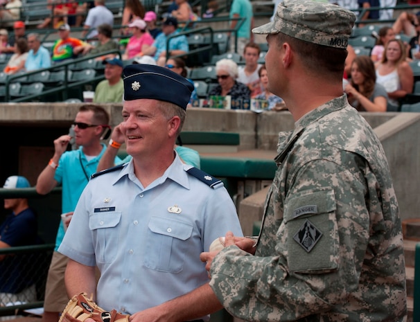 Lt. Col. Dale Skinner, 628th Contracting Squadron commander, prepares to throw his first-ever ceremonial first pitch during Military Appreciation Night July 19, 2014, at Joseph P. Riley Jr. ballpark in Charleston, S.C. More than 5,000 fans were in attendance for the game, which honored local military members. (U.S. Air Force photo/ Staff Sgt. William A. O’Brien)