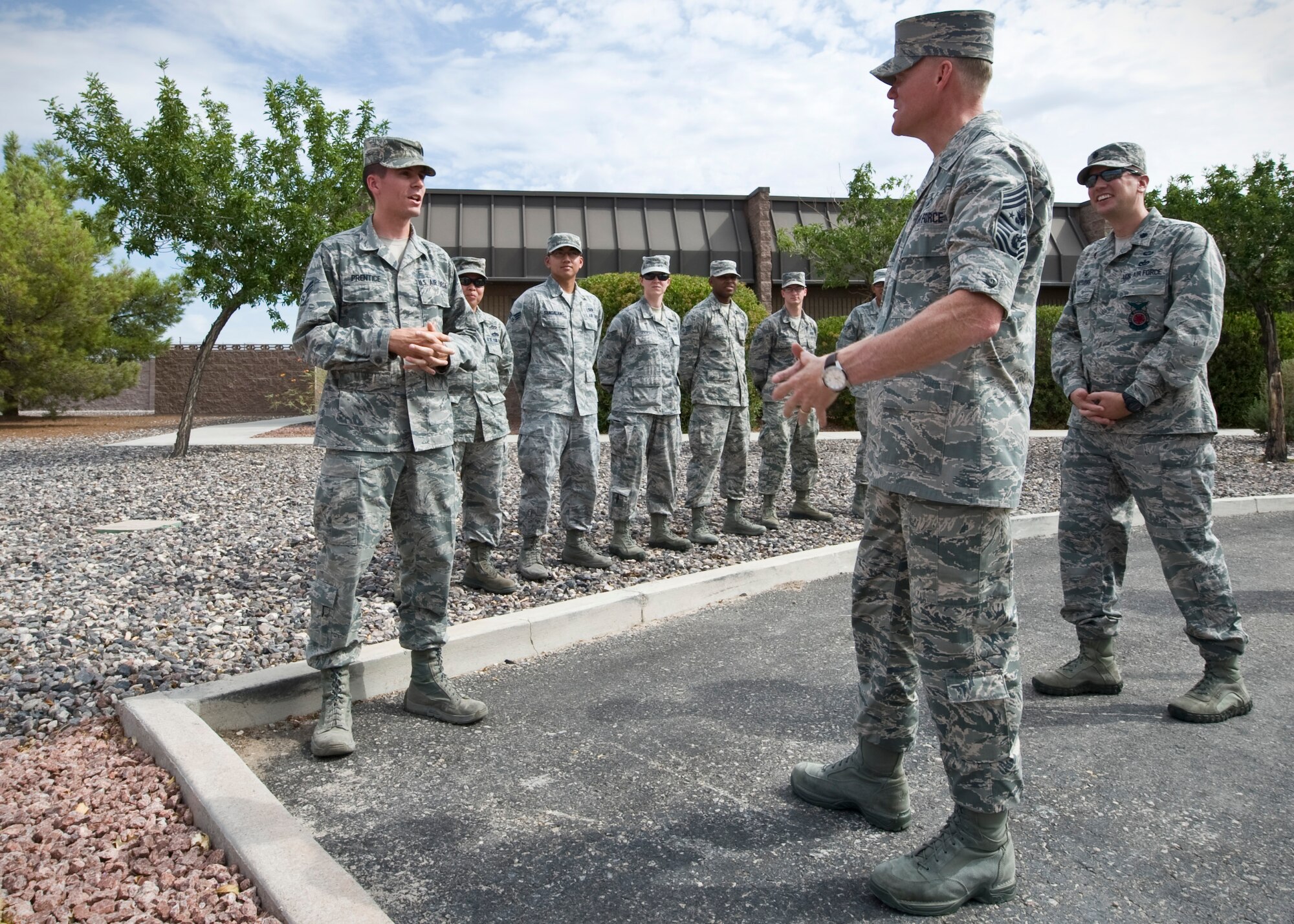 Chief Master Sgt. of the Air Force, James A. Cody speaks to 99th Civil Engineer Squadron Airmen about surveying equipment July 17, 2014, during a visit to Nellis Air Force Base, Nev. Cody visited various units to experience first hand how Airmen in different career fields carry out their mission. (U.S. Air Force photo by Senior Airman Jason Couillard)