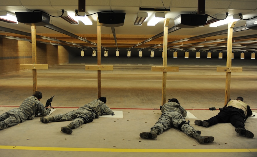 U.S. Air Force Airmen and security contractors zero-in their M4 carbines July 21, 2014, at Dyess Air Force Base, Texas. Airmen are required to qualify with different weapons systems based on the needs of the mission. (U.S. Air Force photo by Airman 1st Class Alexander Guerrero/Released)