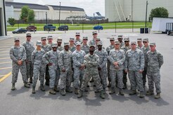 Members of the 628th Civil Engineer Squadron pose for a group photo before deployment to Guantanamo Bay, Cuba, July 17, 2014, at Joint Base Charleston, S.C. Members of the 628th CES deployed to Guantanamo Bay for installation support. (U.S. Air Force photo/Senior Airman George Goslin)