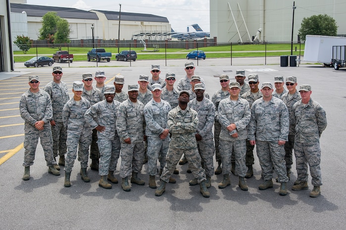 Members of the 628th Civil Engineer Squadron pose for a group photo before deployment to Guantanamo Bay, Cuba, July 17, 2014, at Joint Base Charleston, S.C. Members of the 628th CES deployed to Guantanamo Bay for installation support. (U.S. Air Force photo/Senior Airman George Goslin)