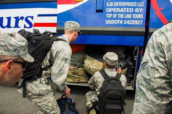 Members of the 628th Civil Engineer Squadron prepare for deployment to Guantanamo Bay, Cuba, July 17, 2014, at Joint Base Charleston, S.C. Members of the 628th CES deployed to Guantanamo Bay for installation support. (U.S. Air Force photo/Senior Airman George Goslin)