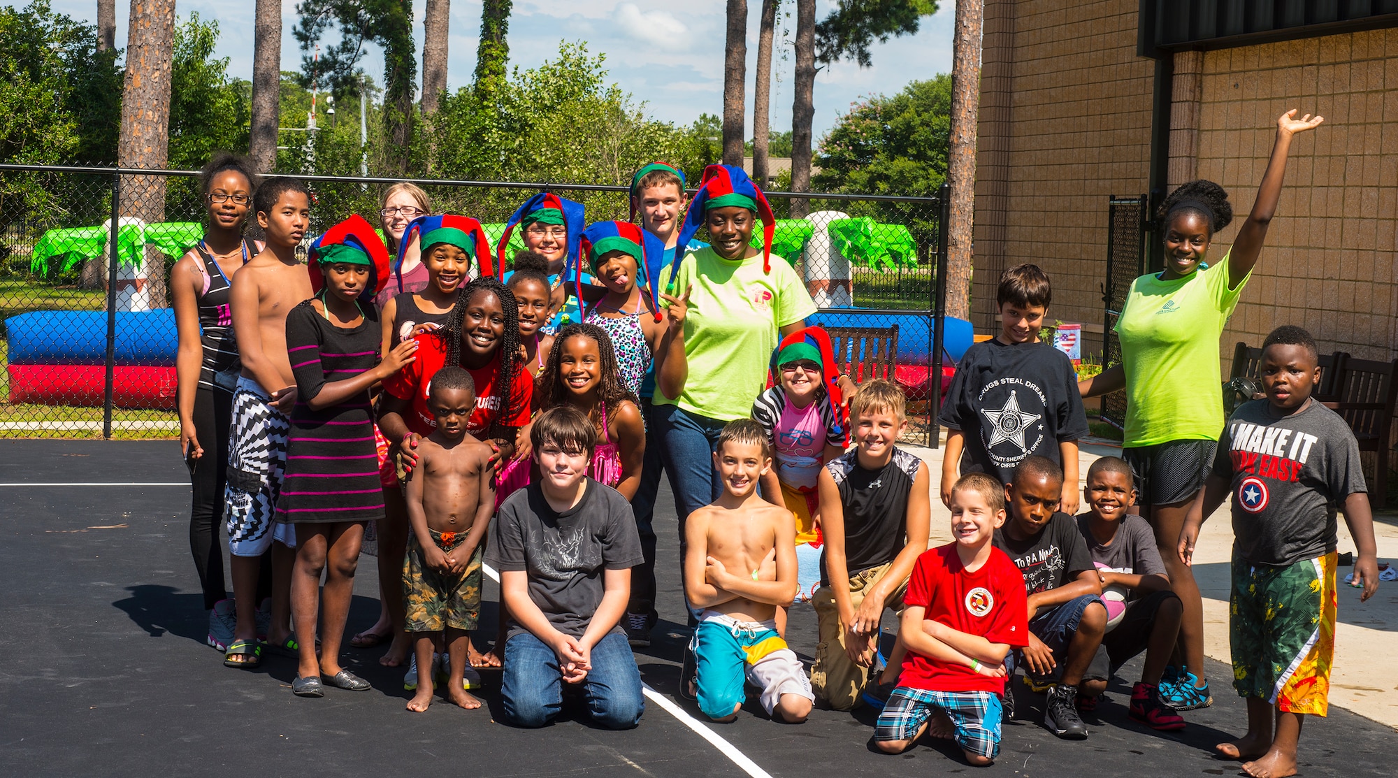 Youth and youth leaders pose for a group photo during the July Jamboree at Moody Air Force Base, Ga., July 22, 2014. The event was held to get children back to the basics of being outside instead of being stuck inside. (U.S. Air Force photo by Airman 1st Ceaira Tinsley/Released)