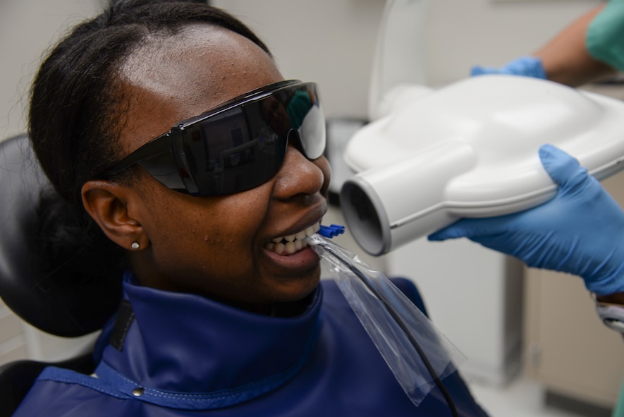 U.S. Air Force Airman 1st Class Ceaira Tinsely, 23d Wing public affairs photojournalist, receives an x-ray at the 23d Medical Group dental clinic at Moody Air Force Base, Ga. July 22, 2014. The x-ray was used to check for any damage to Tinsely’s tooth or filling. (U.S. Air Force photo by Airman 1st Class Sandra Marrero/Released)
