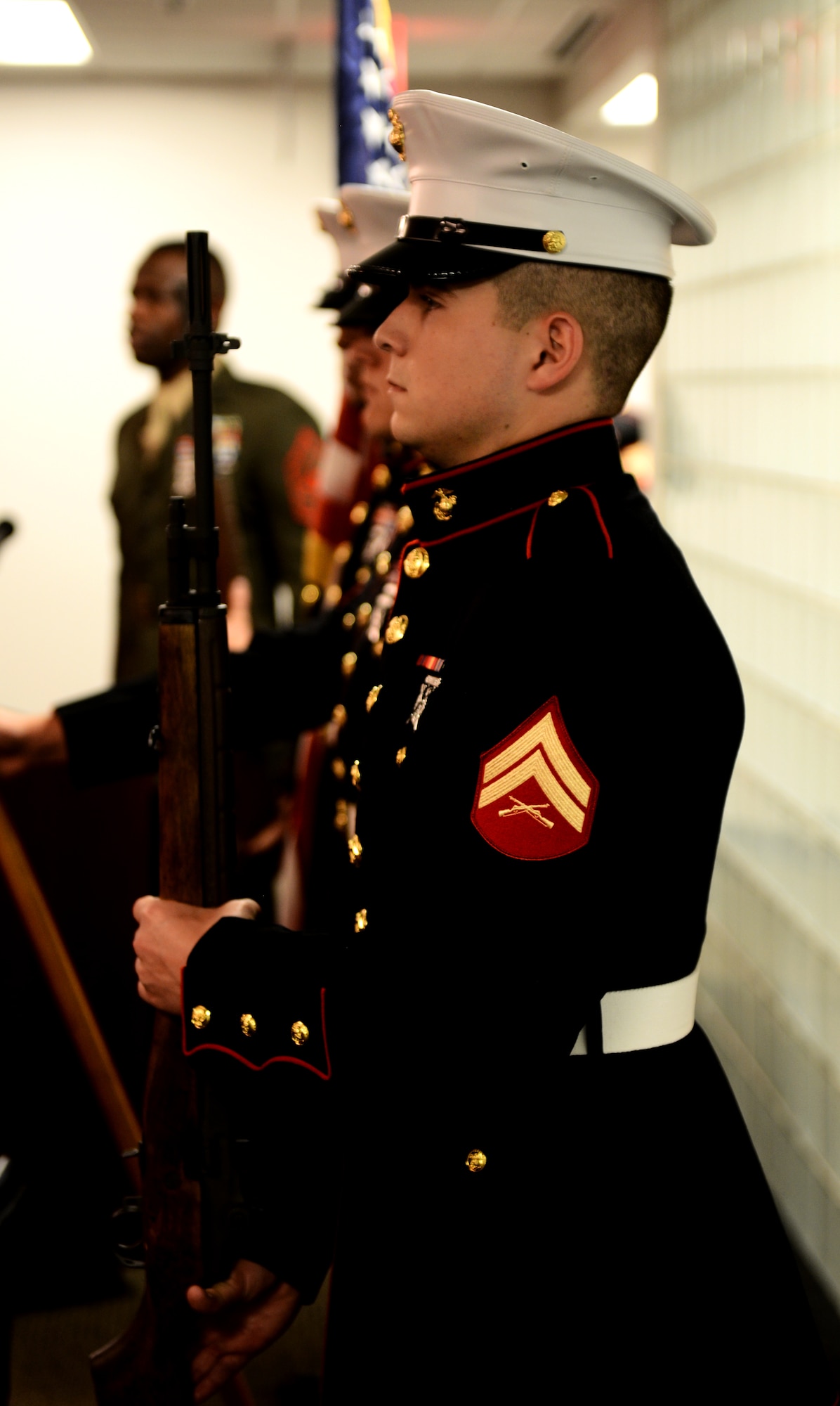 Members of a Marine Honor Guard detail posted the colors as the U.S. Army Spc. Sterling Wyatt dedication ceremony begins at the St. Louis Military Entrance Processing Station in St. Louis, Mo., July 17, 2014. Over 70 people gathered at the St. Louis MEPS for the dedication. (U.S. Air Force photo by Senior Airman Jake Eckhardt)