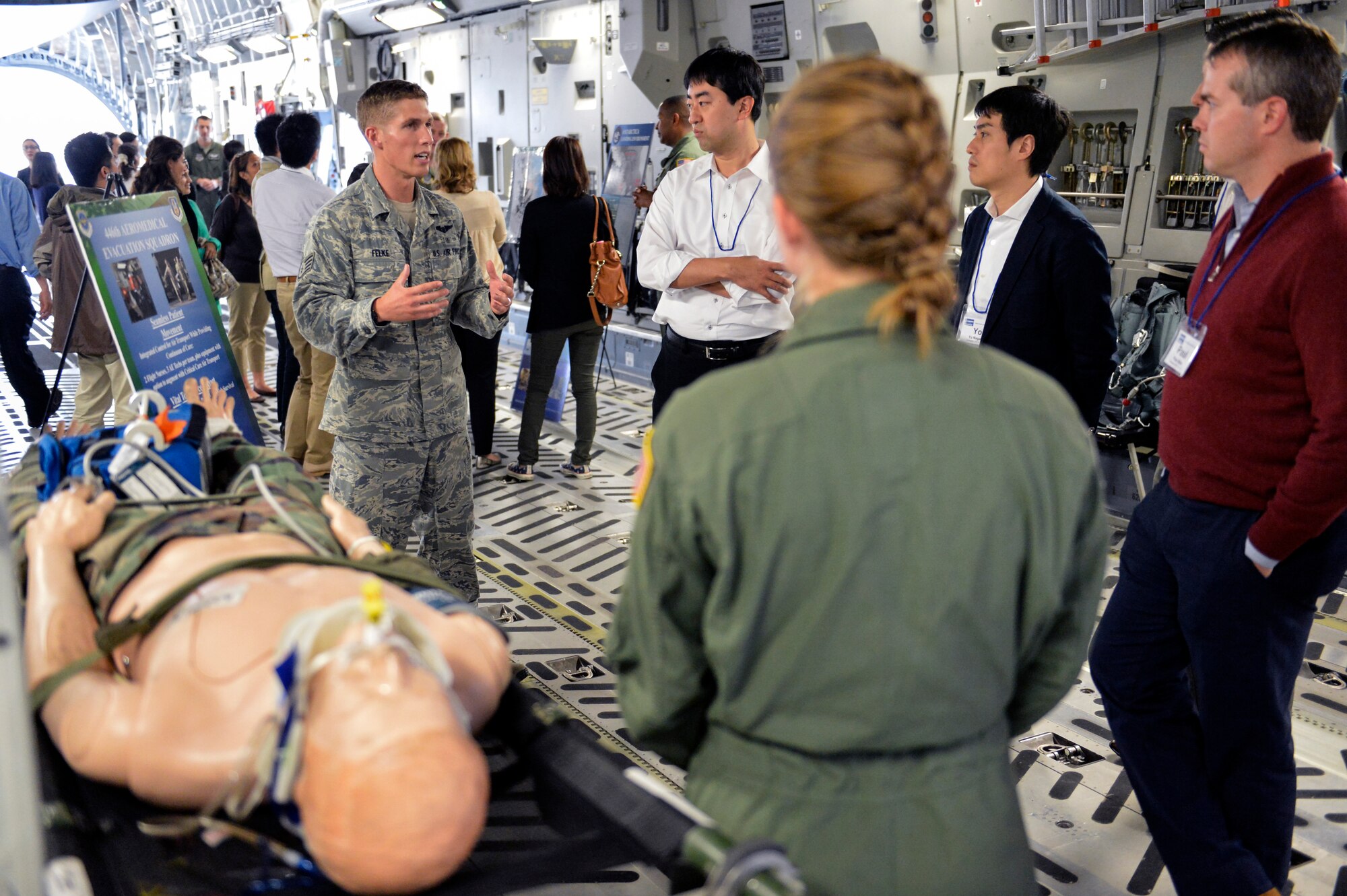 Staff Sgt. Zachary Felke, 446th Aeromedical Evacuation Squadron NCO of training, discusses injured patient movement July 22, 2014, to members of the U.S. Japan Leadership Program onboard a C-17 Globemaster III at Joint Base Lewis-McChord. The USJLP is managed by the United States-Japan Foundation and is the only private American grant-making foundation dedicated to the mutual interests of the American and Japanese people. (U.S. Air Force photo/Staff Sgt. Russ Jackson)