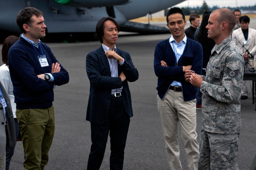 Staff Sgt. David Luken, 1st Weather Squadron weather forecaster, justifies the importance of up-to-the-second weather information on the battlefield July 22, 2014, to members of the U.S. Japan Leadership Program at Joint Base Lewis-McChord. The visit to JBLM strengthened participants understanding and appreciation of U.S. military operations and the role of military relations in the U.S.-Japan alliance. (U.S. Air Force photo/Staff Sgt. Russ Jackson)