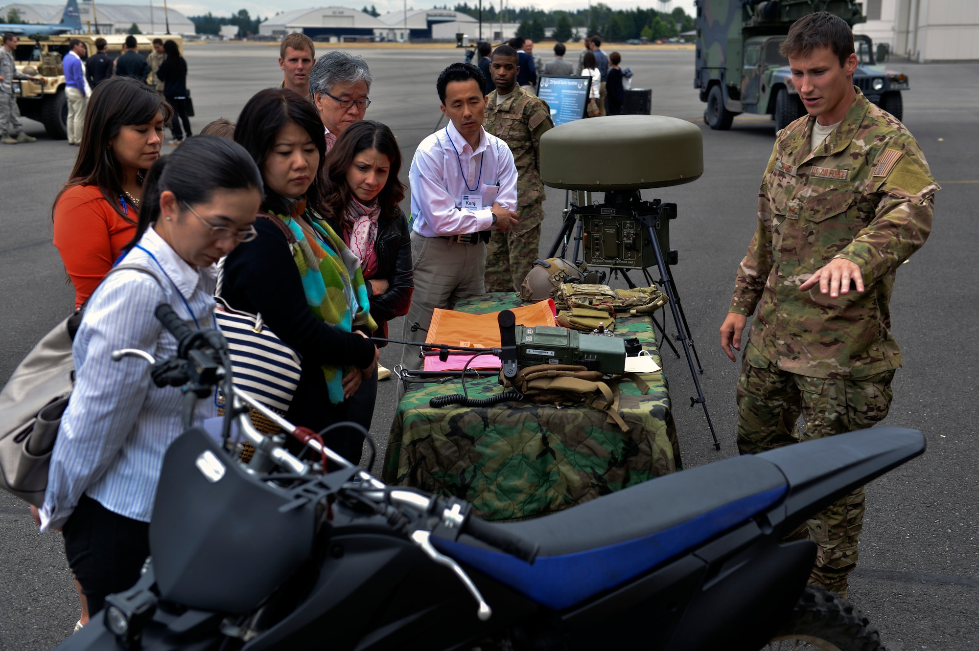 Staff Sgt. Mitchell Spees, 22nd Special Tactics Squadron combat controller, explains the capabilities of the 22nd STS July 22, 2014, to members of the U.S. Japan Leadership Program at Joint Base Lewis-McChord. The purpose of the USJLP is to develop a network of communication, friendship and understanding among the next generation of leaders from each country. (U.S. Air Force photo/Staff Sgt. Russ Jackson)