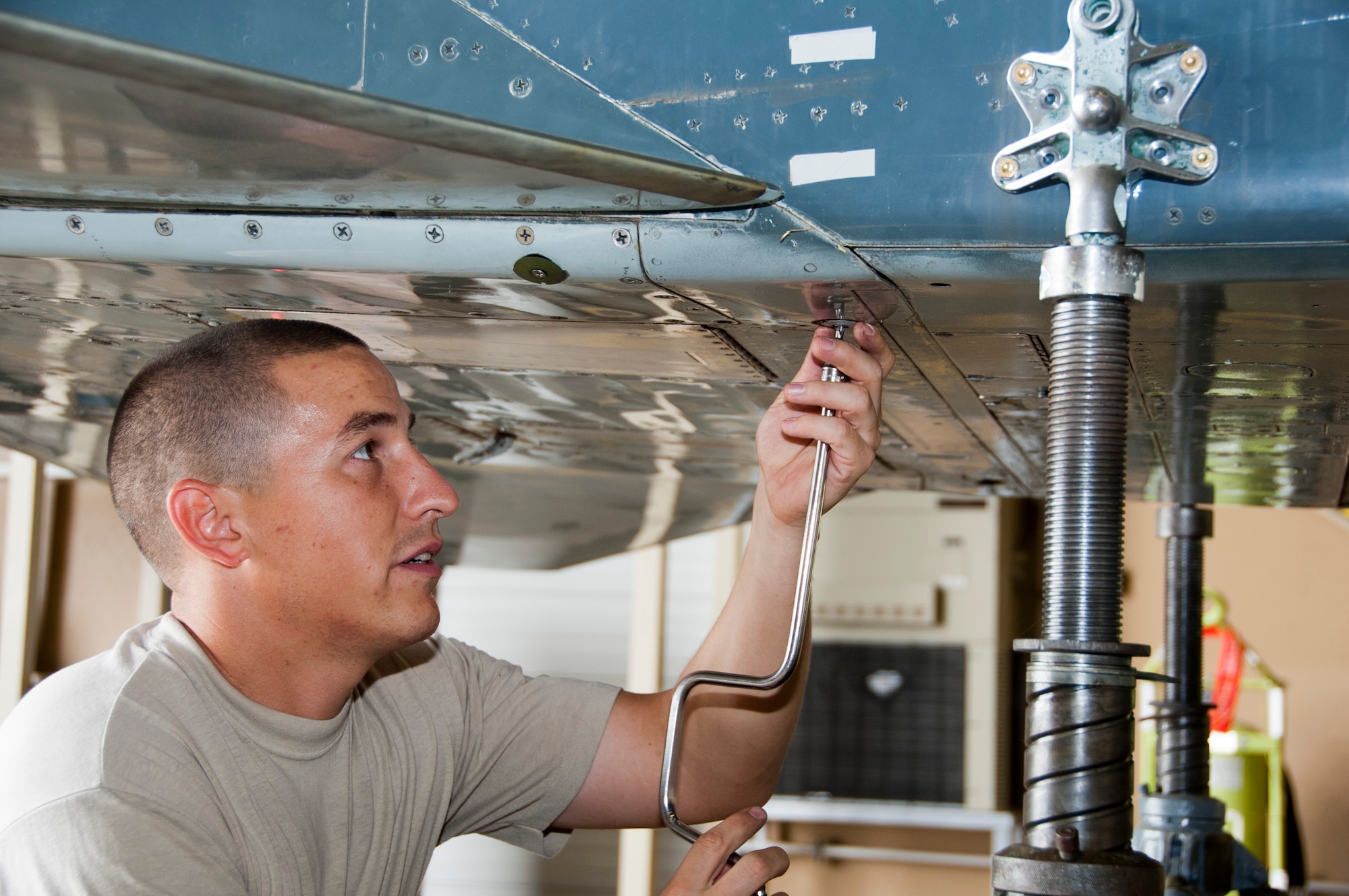 Tech. Sgt. Michael Barreras, 362nd Training Squadron instructor, volunteers his time to restore a T-38 Talon at Sheppard Air Force Base, Texas, July 19, 2014. Once completed, the T-38 will be on display next to a 98-year-old Jenny biplane inside the newly renovated Wichita Falls Municipal Airport, embodying the partnership shared by Sheppard and the local community. (U.S. Air Force photo/Airman 1st Class Robert L. McIlrath)