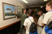 Maj. Brian Caramello, 560th Flying Training Squadron, briefs ACE Camp students on an aviation maneuver carried out by Capt. Bob Pardo in order to move his wingman's badly damaged F-4 Phantom II to friendly air space during the Vietnam War. The ACE Camp offers young people ages 14-17 an opportunity to explore the many career options available in the aviation industry. (U.S. Air Force photo by Johnny Saldivar)