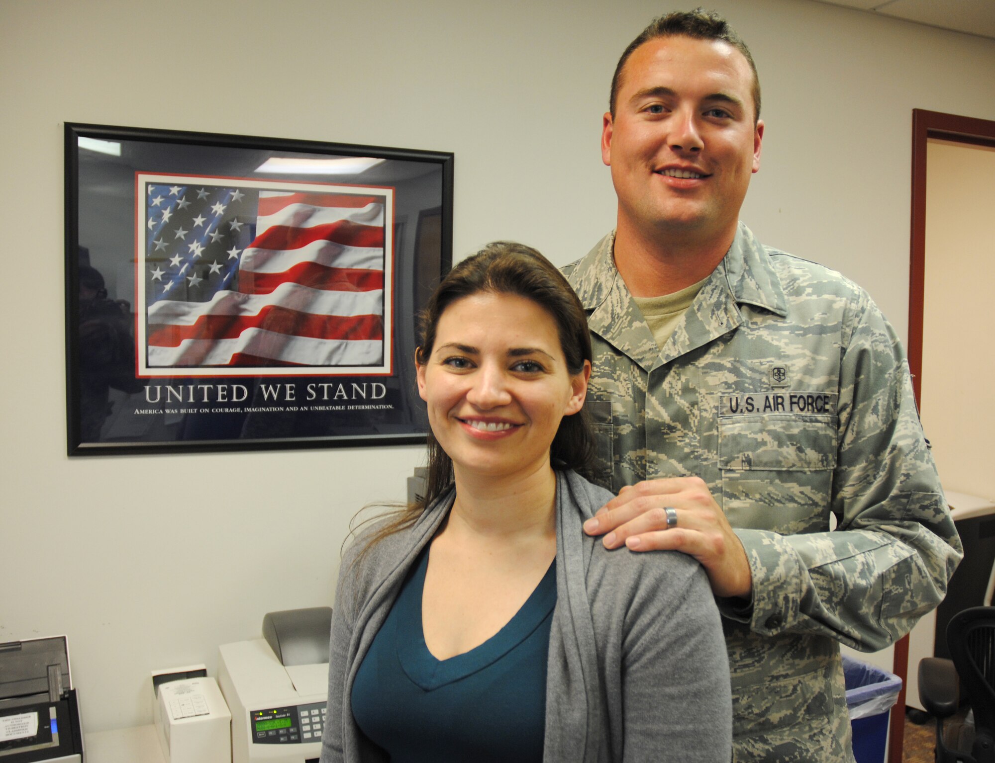 Laura Sullivan, 319th Medical Operations Squadron office administrator, and her husband, Staff Sgt. Thomas C. Sullivan Jr., a laboratory technician with 319th Medical Support Squadron, pose for a photo on July 14, 2014, at the family health clinic on Grand Forks Air Force Base, N.D.  The Sullivans are the first-ever husband and wife duo at Grand Forks AFB to be named Warriors of the Week from the same Air Force group (319th Medical Group). Staff Sgt. Sullivan was named the Warrior of the Week for the last week of May 2013, while Mrs. Sullivan was named the Warrior of the Week for the fourth week of July 2014. (U.S. Air Force photo/Staff Sgt. Luis Loza Gutierrez)
