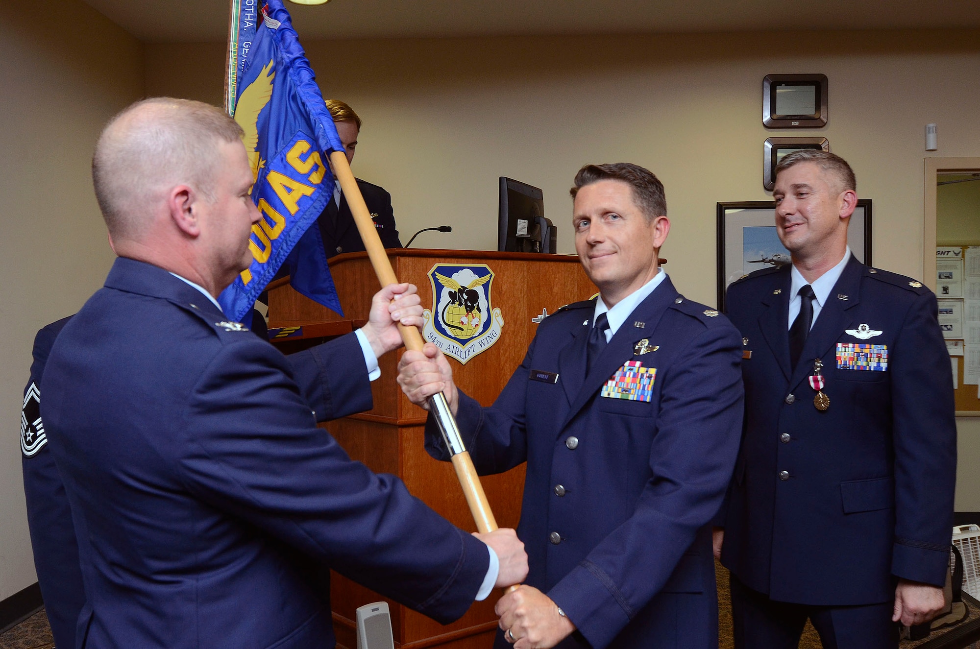 Lt. Col. Christopher M. Gohlke assumes command of the 700th Airlift Squadron, Dobbins Air Reserve Base, Ga., at a ceremony held July 12, 2014. In addition to Dobbins, Gohlke’ s assignments include,  Laughlin Air Force Base, Texas., where he attended undergraduate pilot training and Eglin Air Force Base, Florida., 5th Special Operations Squadron, as an MC-130 instructor pilot. (U.S. Air Force photo/Don Peek)