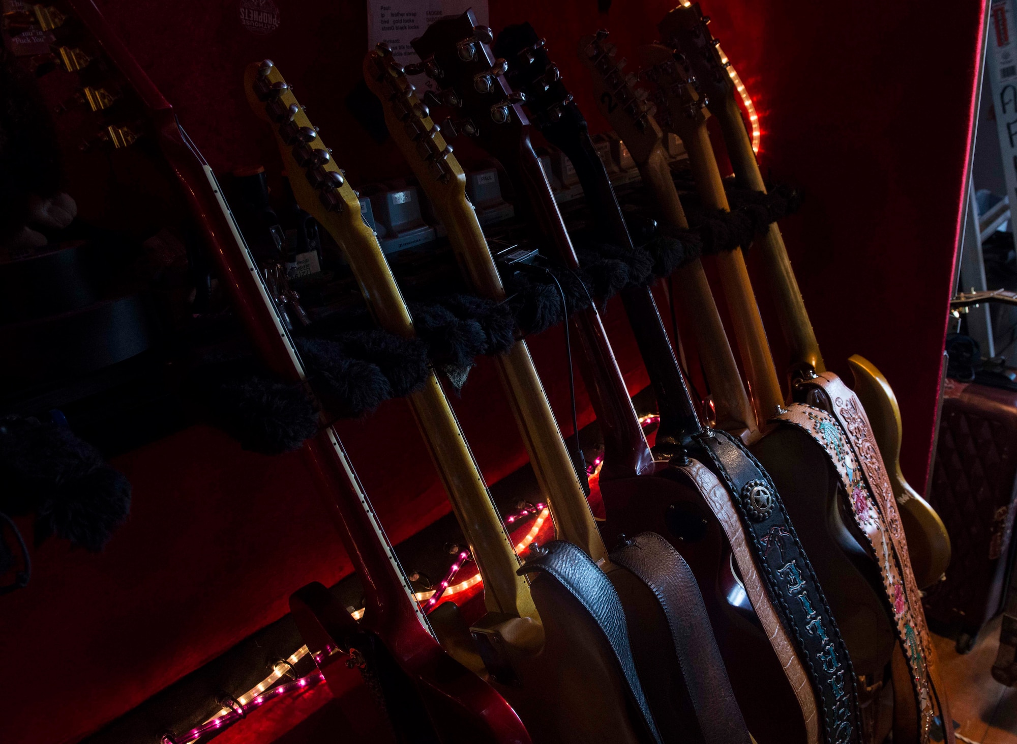 Guitars lay against a wall back stage at the Minot Air Force Base Theater July 21, 2014. Blackberry Smoke performed their mix of bluegrass and rock’n’roll during their free USO concert. (U.S. Air Force photos/Airman 1st Class Lauren Pitts) 