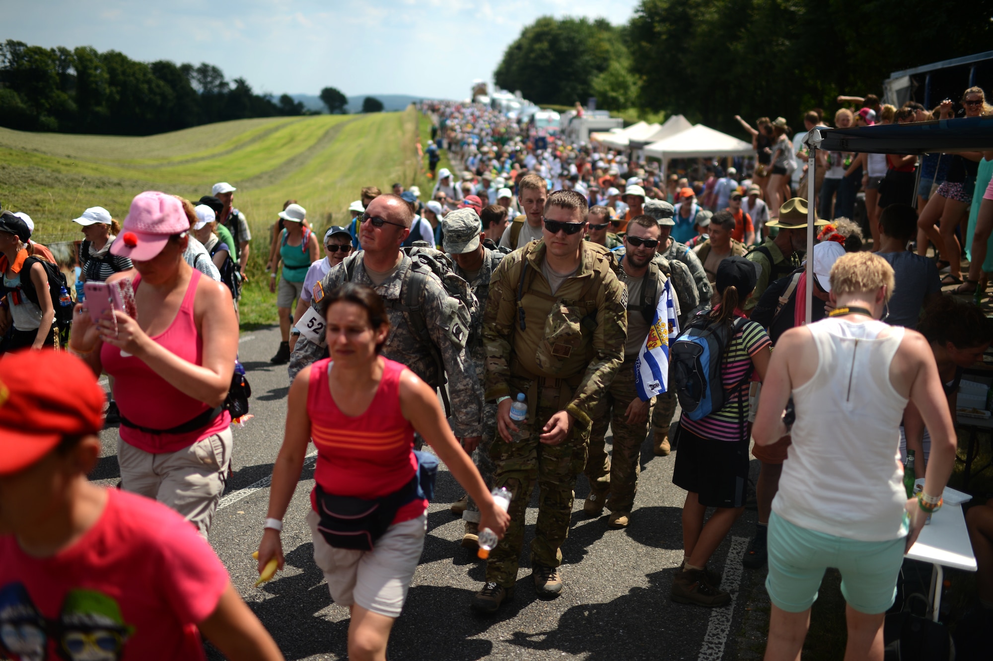 Members of the U.S. Army 361st Civil Affairs Brigade and U.S. Air Force 52nd Fighter wing participating in the International Four Days Marches Nijmegen alongside civilian participants in Nijmegen, Netherlands, July 17, 2014. More than 42,000 participants began the four-day-walk in Nijmegen and its surroundings. (U.S. Air Force photo by Senior Airman Gustavo Castillo/Released)