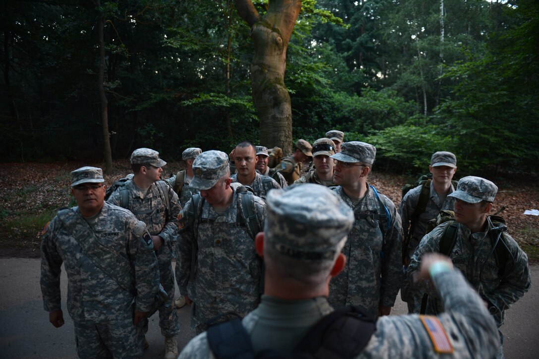 A group of U.S. Airmen and Army members from the U.S. Army 361st Civil Affairs Brigade and the U.S. Air Force 52nd Fighter Wing form up before the first day of the International Four Days Marches Nijmegen in Nijmegen, Netherlands, July 15, 2014. The 98th International Four Days Marches Nijmegen has grown into the largest multi-day walking event in the world. (U.S. Air Force photo by Senior Airman Gustavo Castillo/Released) 