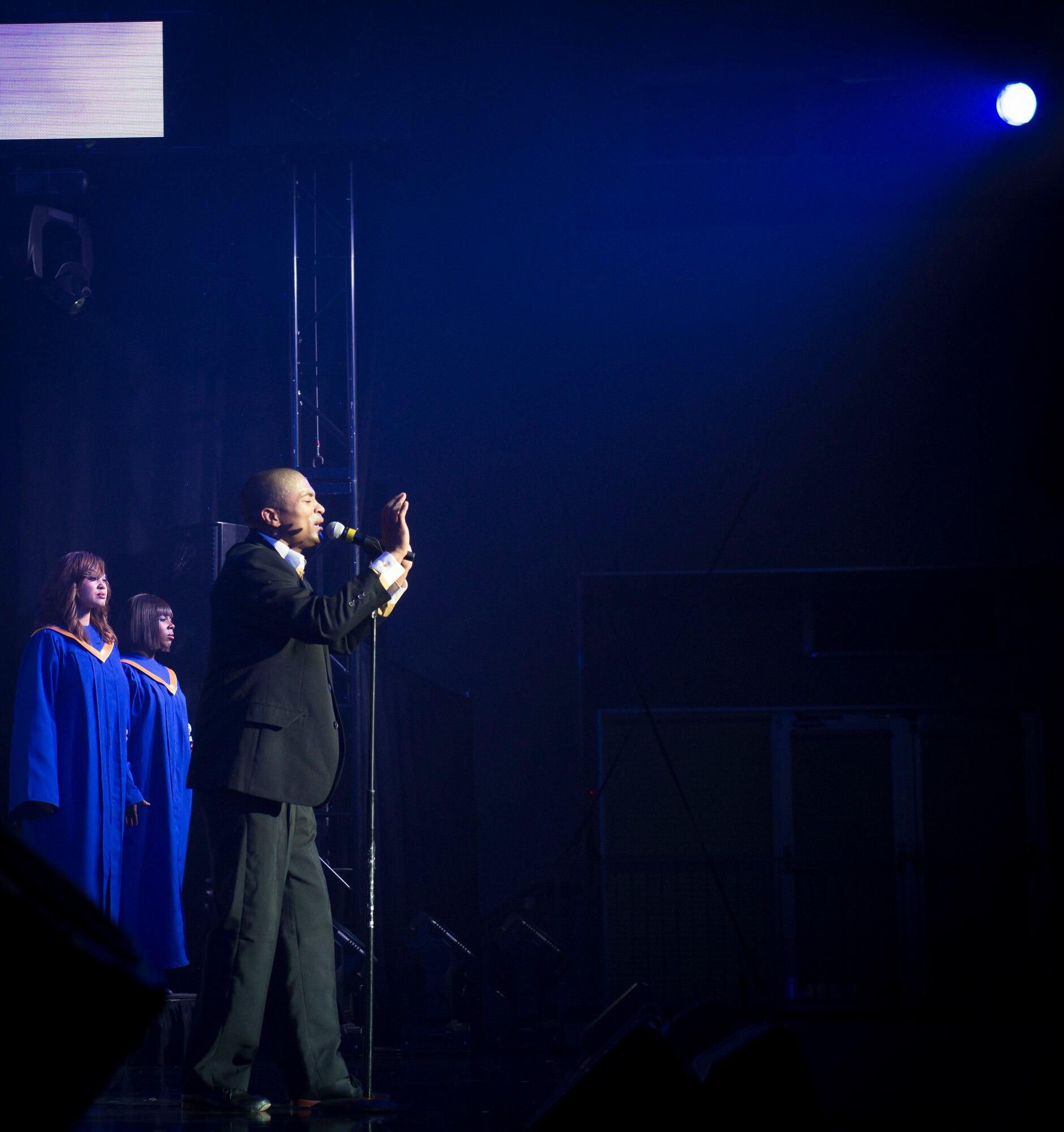 A member from Tops in Blue performs "All of Me" by John Legend at the Taiyo Community Center at Yokota Air Base, Japan, July 22, 2014. Many vocalists performed solos throughout the show from all different types of genres. (U.S. Air Force photo by Airman 1st Class Meagan Schutter/Released)