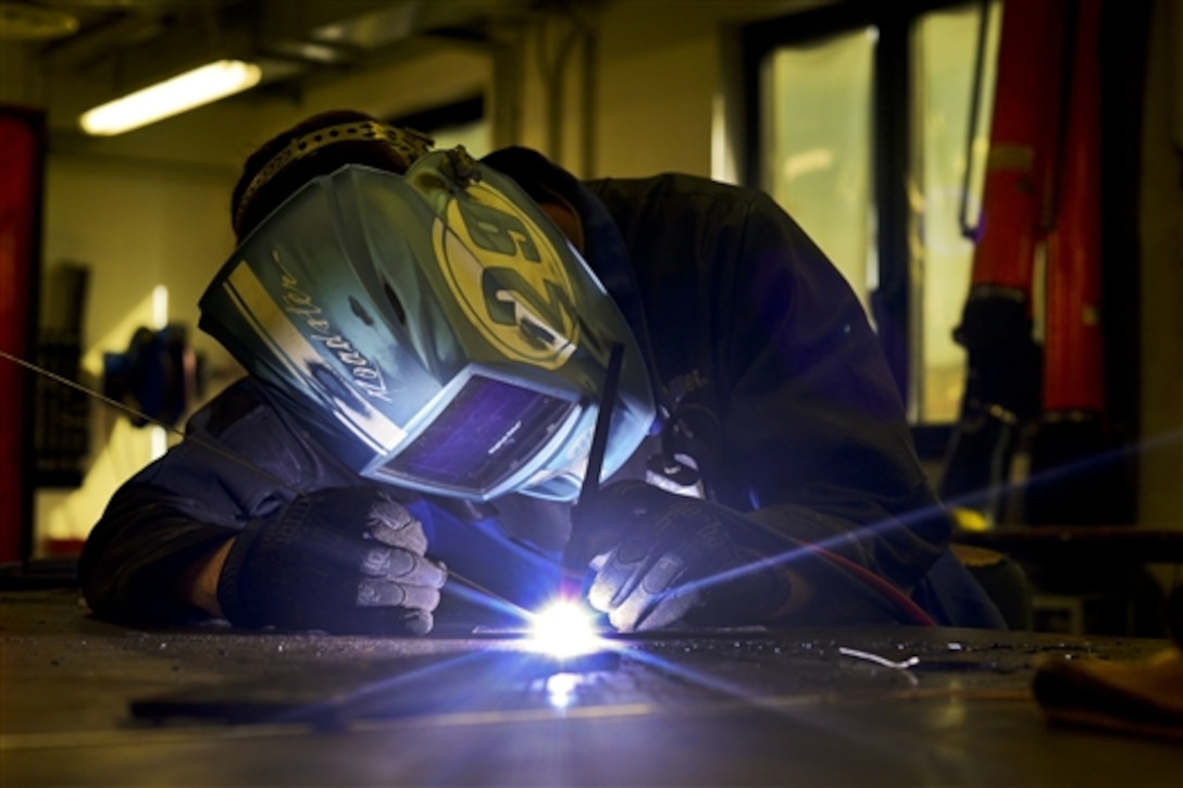 U.S. Air Force Airman 1st Class Daniel Gregory welds metal pieces on Aviano Air Base, Italy, July 9, 2014. The fabrication flight is responsible for fashioning tools, aircraft components and other support systems tailored to the F-16 Fighting Falcon. Gregory is a 31st Maintenance Squadron metals technology journeyman. 