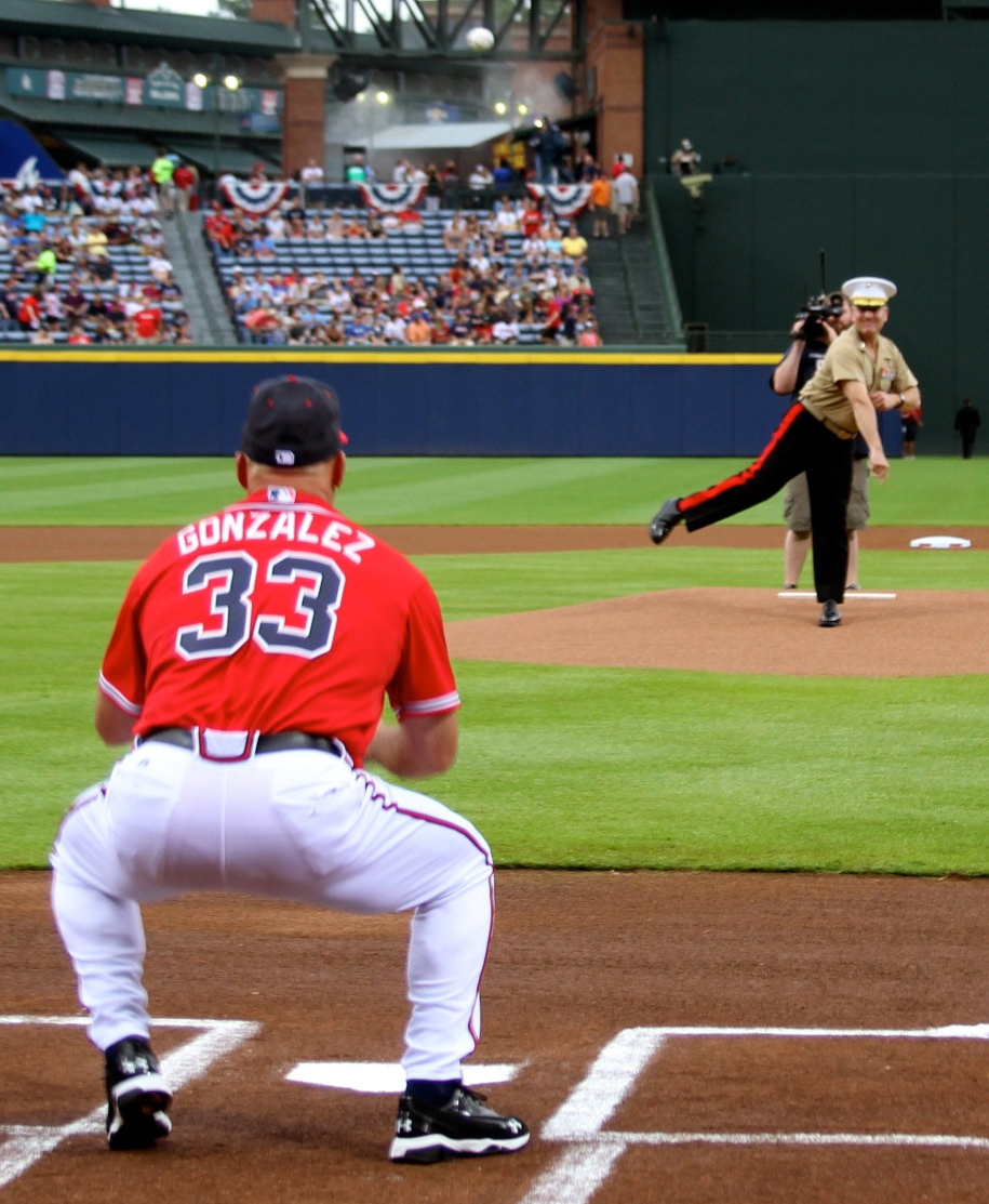 Maj. Gen. John J. Broadmeadow throws the first pitch at the Atlanta Braves game during the Marine Corps Appreciation Day at Turner Field in Atlanta, Georgia, July 19. The celebration included Col. Don Davis, commanding officer, Marine Corps Logistics Base Albany, being the honorary team captain and a tribute to recent Medal of Honor recipient Marine Cpl. Kyle Carpenter. The Atlanta Braves even donned military-themed jerseys that will be auctioned online to benefit the United Military Care, Inc. 