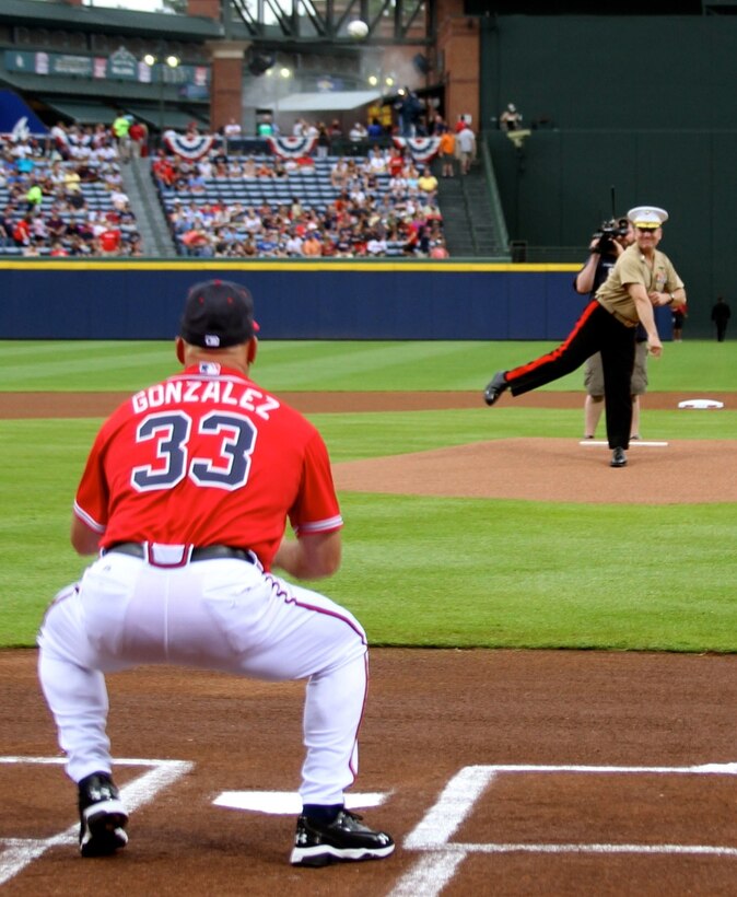 Maj. Gen. John J. Broadmeadow throws the first pitch at the Atlanta Braves game during the Marine Corps Appreciation Day at Turner Field in Atlanta, Georgia, July 19. The celebration included Col. Don Davis, commanding officer, Marine Corps Logistics Base Albany, being the honorary team captain and a tribute to recent Medal of Honor recipient Marine Cpl. Kyle Carpenter. The Atlanta Braves even donned military-themed jerseys that will be auctioned online to benefit the United Military Care, Inc. 