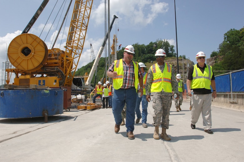 Resident Engineer Bill DeBruyn (Left), U.S. Army Corps of Engineers Nashville District, briefs Lt. Gen. Thomas Bostick, USACE commander and chief engineer, on the work ramp of the Center Hill Dam Seepage Rehabilitation Project during a tour of the project in Lancaster, Tenn., July 22, 2014. Steve Stockton (Right), USACE chief of Civil Works, also toured the project site. (USACE photo by Leon Roberts)