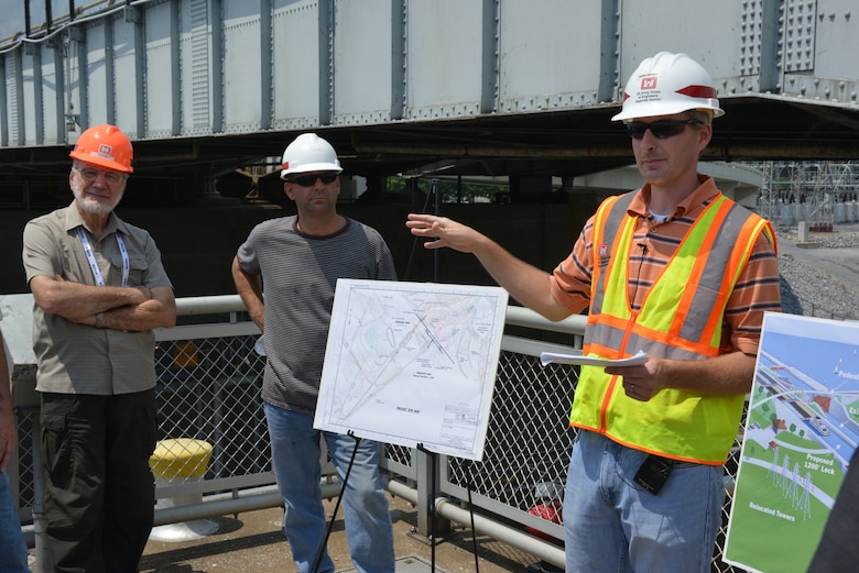 Adam Walker, Project Manager for the Kentucky Lock Addition briefs a large tour group about construction during a visit to the Kentucky Lock Addition construction site on July 22, 2014. The group is attending the HydroVision conference in Nashville, Tenn., at the Music City Center. The four-day event, which has been held for two decades, highlights the work of the U.S. Army Corps of Engineers.