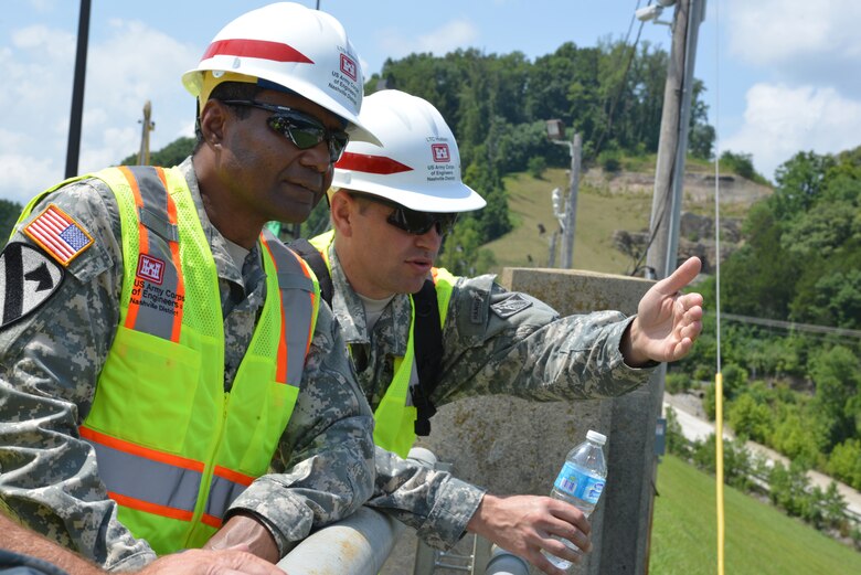 (Left) Nashville District commander, Lt. Col. John L. Hudson briefs Lt. Gen. Thomas P. Bostick, the Army's chief of engineers and USACE commanding general of the construction progress at the Center Hill Dam July 22, 2014.