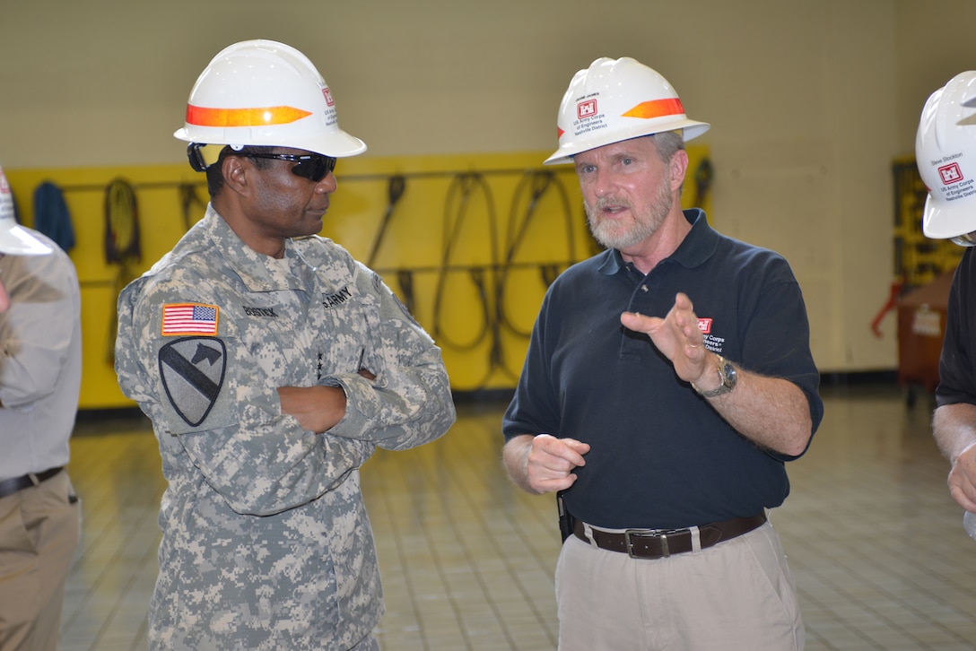 (Right) Jamie James, Nashville District Hydropower program manager briefs U.S. Army Corps of Engineers Commanding General Lt. Gen. Thomas P. Bostick, during a tour at the Center Hill Dam power plant July 22, 2014. 