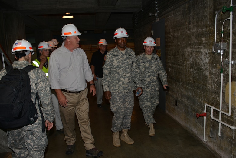 (Left) Jeff Flowers, Center Hill power plant superintendant talks with U.S. Army Corps of Engineers Commanding General Lt. Gen. Thomas P. Bostick and U.S. Army Corps of Engineers’ Great Lakes and Ohio River Division Commander, Col. Steven J. Roemhildt during a tour of the Center Hill Dam generators inside the power house on July 22, 2014.