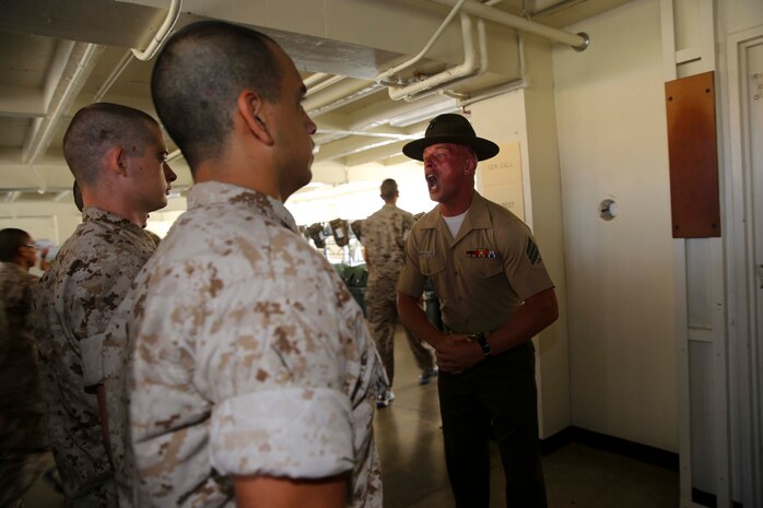 Sgt. Anthony J. Juedes, drill instructor, Platoon 2129, Fox Company, 2nd Recruit Training Battalion, gives recruits instructions during platoon pick up at Recruit Depot San Diego, Calif., July 18. Following pick up, recruits have 12 weeks of training before becoming Marines.