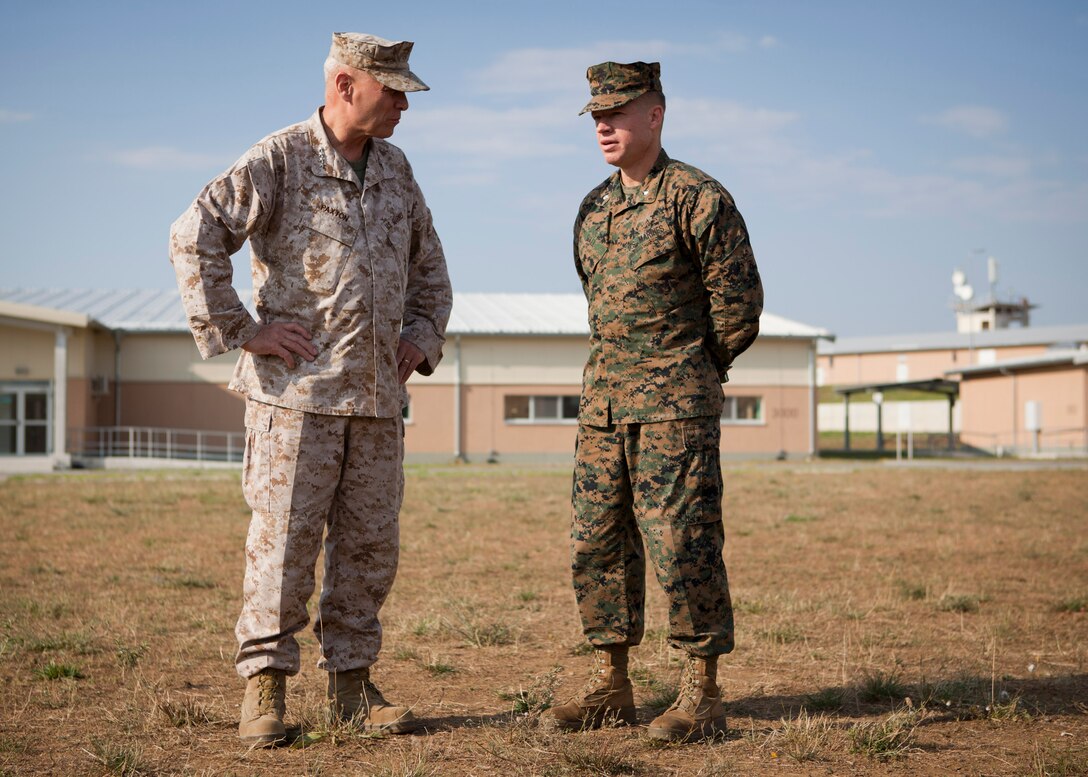 The Assistant Commandant of the Marine Corps, Gen. John M. Paxton, Jr., visits with Marines training on Novo Selo Range in Vidin Province, Bulgaria, July 17, 2014. The Marines are part of the Black Sea Rotational Force training in the region with the Bulgarian Army. (U.S. Marine Corps photo by Cpl. Tia Dufour/Released)