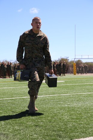Recruit Anthony I. Mansfield, Platoon 1066, Delta Company, 1st Recruit Training Battalion, carries two 30-pound ammunition cans in the maneuver under fire portion of the Combat Fitness Test at Marine Corps Recruit Depot San Diego, June 17. Mansfield is a Huntington Beach, Calif., native and was recruited out of Recruiting Station  Santa Ana, Calif.