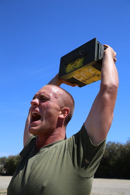 Recruit John R. Scott, Platoon 1061, Delta Company, 1st Recruit Training Battalion, performs ammunition can lifts during the Combat Fitness Test at Marine Corps Recruit Depot San Diego, July 17. Recruits must perform 91 ammunition can lifts to achieve a perfect score. Scott is an Austin, Texas, native and was recruited out of North Austin, Texas. 