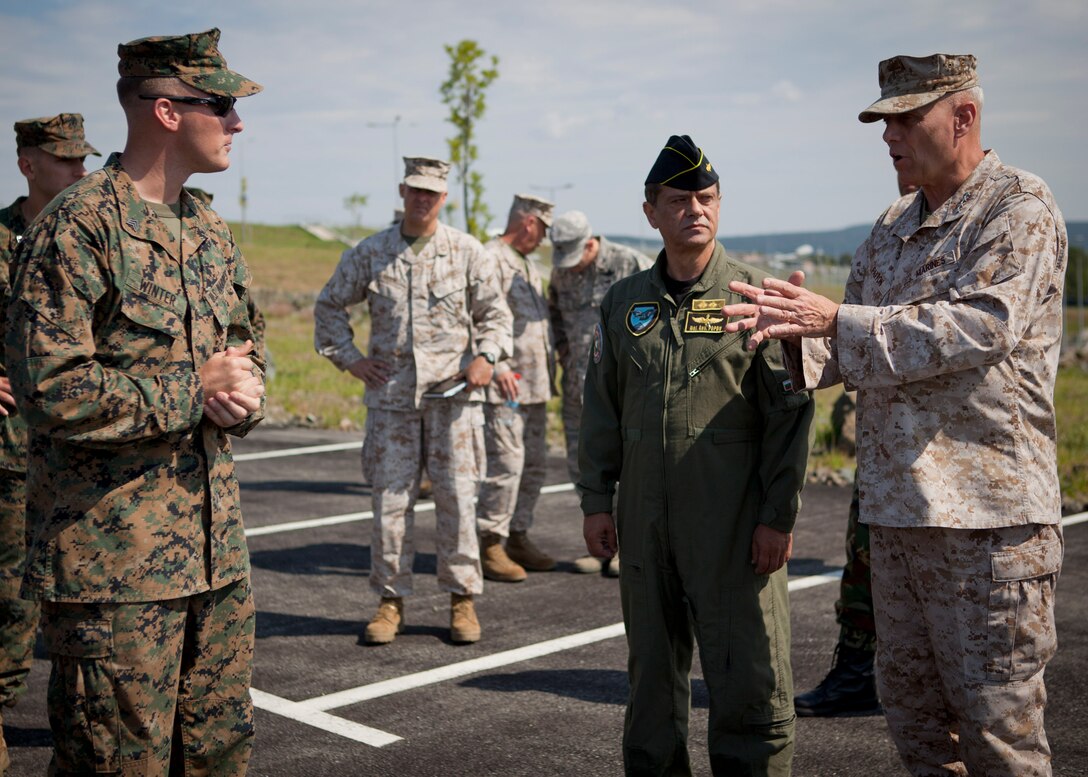 The Assistant Commandant of the Marine Corps, Gen. John M. Paxton, Jr., visits with Marines training on Novo Selo Range in Vidin Province, Bulgaria, July 17, 2014. The Marines are part of the Black Sea Rotational Force training in the region with the Bulgarian Army. (U.S. Marine Corps photo by Cpl. Tia Dufour/Released)