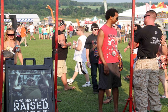 Marines with Marine Corps Recruiting Station Twin Cities speak to concert-goers at RockFest 2014 in Cadott, Wisconsin. During the music festival, fans of Aerosmith and Rob Zombie conducted pull ups with the RS Twin Cities Marines.