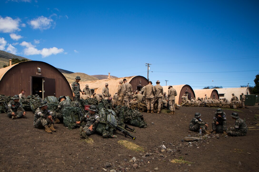 POHAKULOA TRAINING AREA, Hawaii - Marines with the Republic of Korea and the U.S. attached to Combined Landing Team 3 prepare to depart for a 15 km hike during the Rim of the Pacific (RIMPAC) Exercise 2014, July 18. The hike was a movement to get from base camp to their staging area, where they will begin training on multiple ranges, each offering their own unique functions. Twenty-two nations, more than 40 ships and submarines, about 200 aircraft and 25,000 personnel are partcipating in RIMPAC from June 26 to Aug. 1 in and around the Hawaiian Island and Southern California. The world’s largest international maritime exercise, RIMPAC provides a unique training opportunity that helps foster and sustain the cooperative relationships that are critical to ensuring the safety of sea lanes and security on the world’s oceans. RIMPAC 2014 is the 24th exercise in the series that began in 1971. (U.S. Marine Corps photo by Lance Cpl. Wesley Timm/Released) 