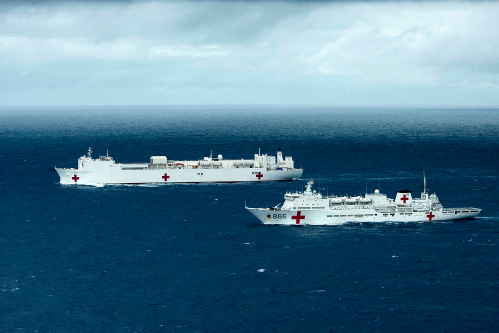 PACIFIC OCEAN (July 22, 20140) - Military Sealift Command hospital ship USNS Mercy (T-AH 19) and China's People's Liberation Army (Navy) hospital ship Peace Ark (T-AH 866) transit together during exercise Rim of the Pacific (RIMPAC) 2014. This is the first year hospital ships have participated in RIMPAC. Twenty-two nations, 49 ships and six submarines, more than 200 aircraft and 25,000 personnel are participating in RIMPAC exercise from June 26 to Aug. 1 in and around the Hawaiian Islands and Southern California. The world's largest international maritime exercise, RIMPAC provides a unique training opportunity that helps participants foster and sustain the cooperative relationships that are critical to ensuring the safety of sea lanes and security on the world's oceans. RIMPAC 2014 is the 24th exercise in the series that began in 1971. 140722-N-VY375-775

