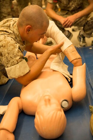 Recruit Dakota R. Morrison, Platoon 1042, Charlie Company, 1st Recruit Training Battalion, practices combat care on a simulated casualty with a chemical burn at Marine Corps Recruit Depot San Diego, July 22. Recruits rotated between stations ensuring they had the opportunity to receive hands-on experience for each station. Morrison is a Sparta, Ill., native and was recruited out of Recruiting Station Carbondale, Ill.
