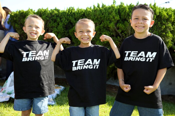 Grayson, 4, Tristan, 6, and Aiden, 8, showed off their best "Rock" poses as they awaited his arrival at the base theater July 24.

Actor Dwayne "The Rock" Johnson visited Camp Pendleton for a screening of his new movie "Hercules" and to conduct a meet and greet with fans.