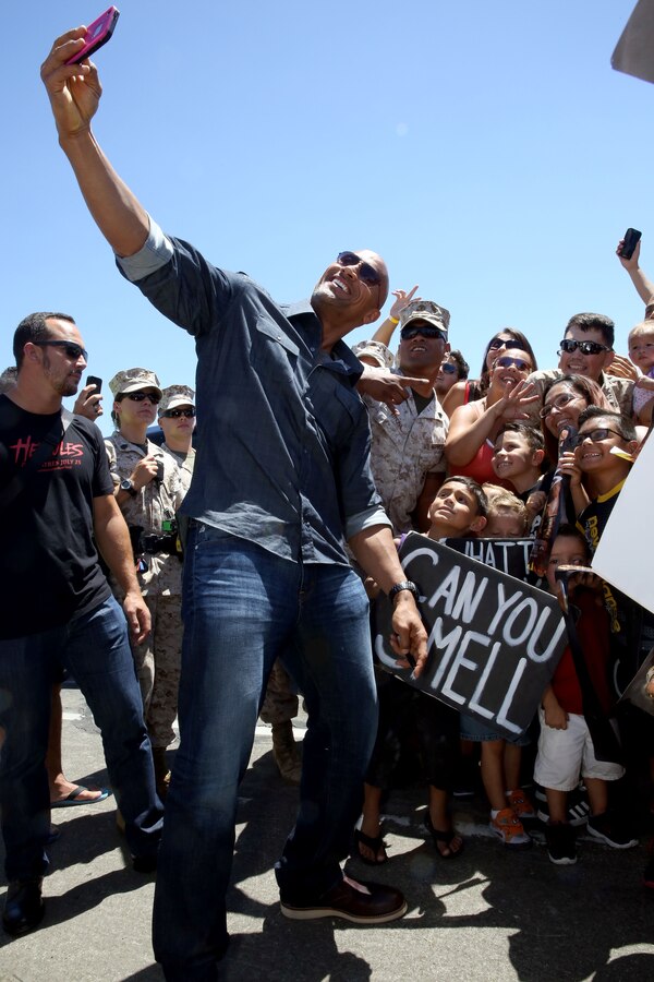 Actor Dwayne "The Rock" Johnson took selfies with fans before the screening of his new movie "Hercules" at the base theater here July 24.

Thousands of fans lined up as early as 3 a.m. to meet the actor.