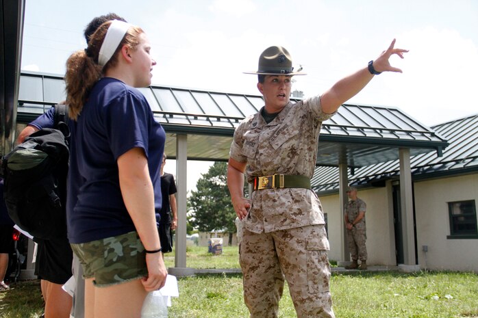 Sergeant Lindsey Rodriguez, a Company O, 4th Recruit Training Battalion, Marine Corps Recruit Depot Parris Island drill instructor, instructs poolees to attempt to "find their volume" during Recruiting Station Kansas City's all-hands pool function at Camp Clark in Nevada, Mo., June 20, 2014. 