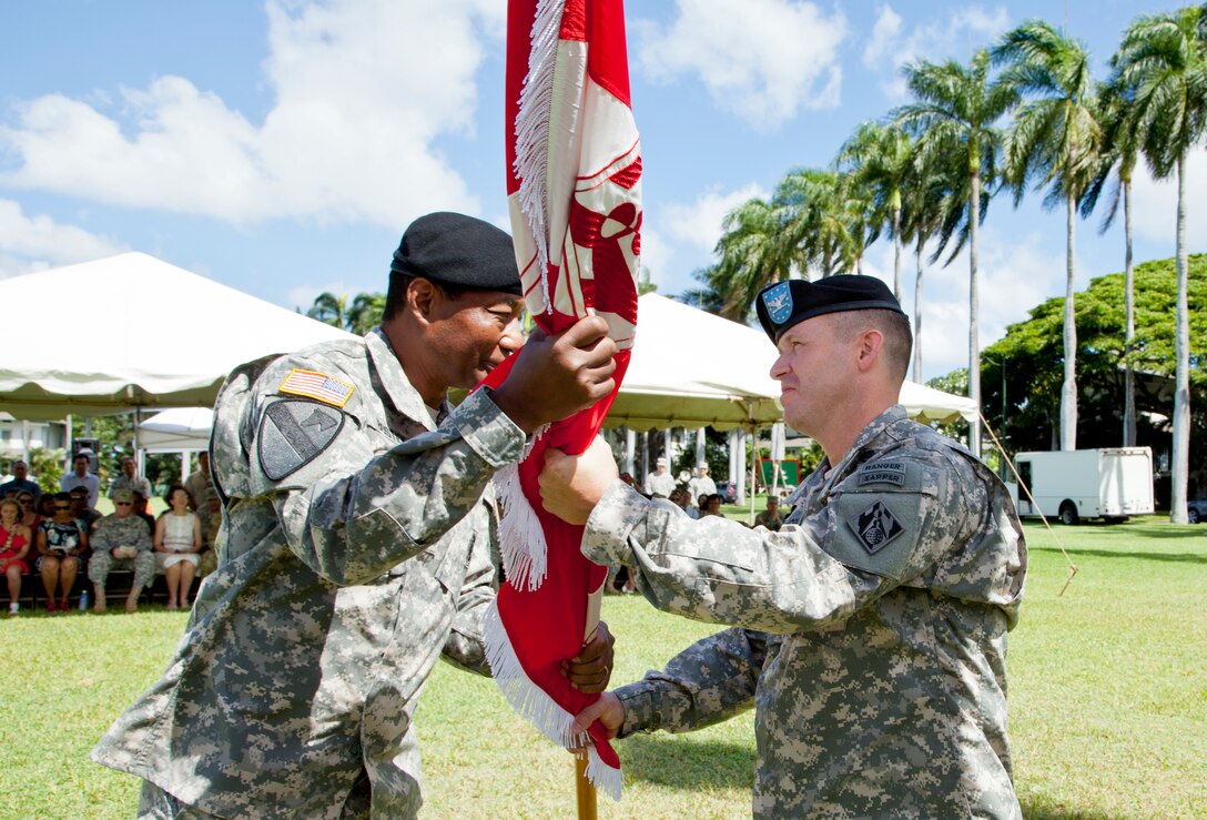 Col. Jeffrey L. Milhorn (r) receives the Army Colors from Lt. Gen. Thomas P. Bostick, during a Change-of-Command ceremony, July 18, on Palm Circle, Fort Shafter. Milhorn became the 31st commander of the Army Corps’ Pacific Ocean Division.