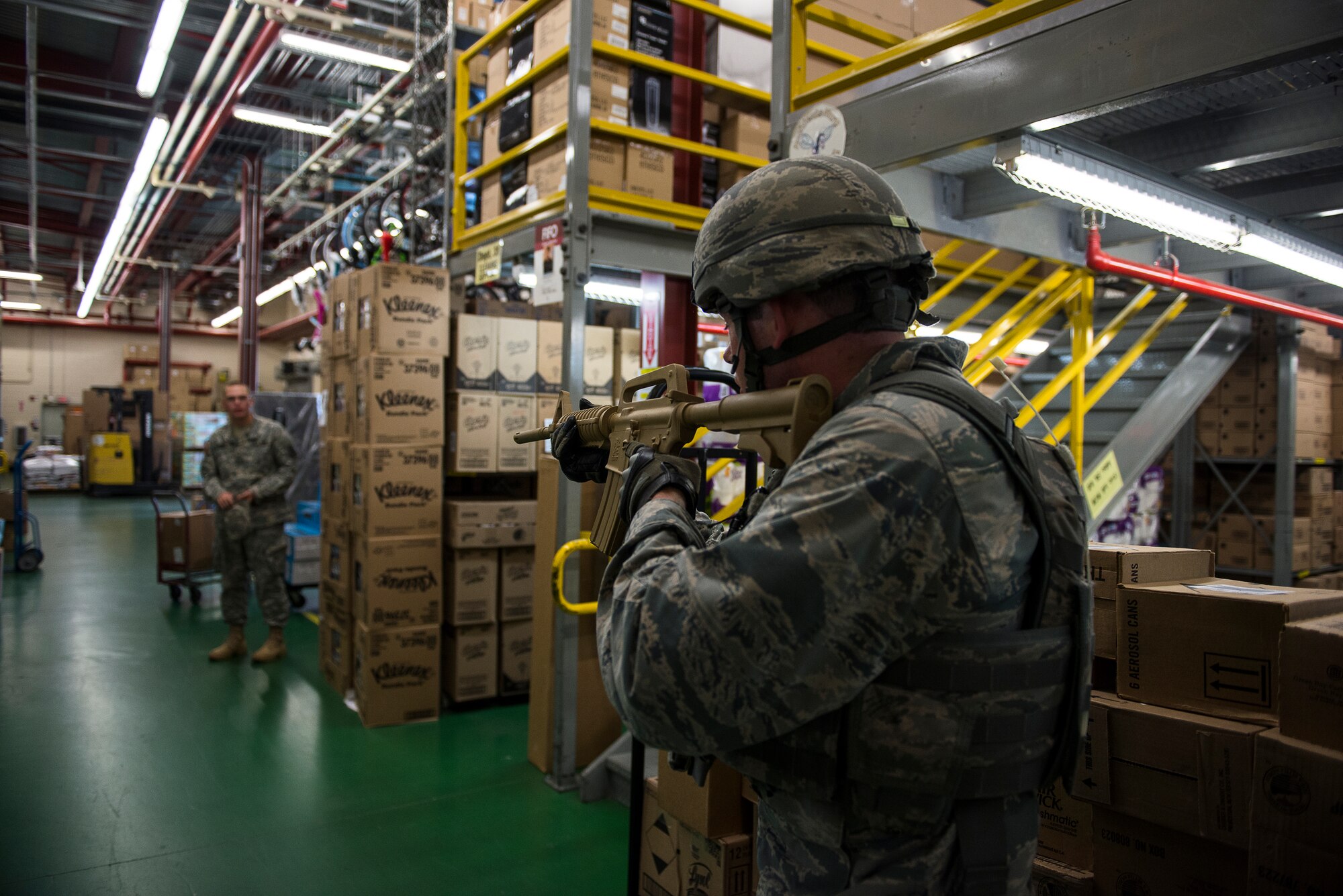 A 51st Security Forces Squadron responder questions an eye witness during an active-shooter exercise July 24, 2014. The purpose of exercise Beverly Midnight 14-03 was to test the base's emergency, recovery and defense capabilities. (U.S. Air Force photo by Staff Sgt. Jake Barreiro)