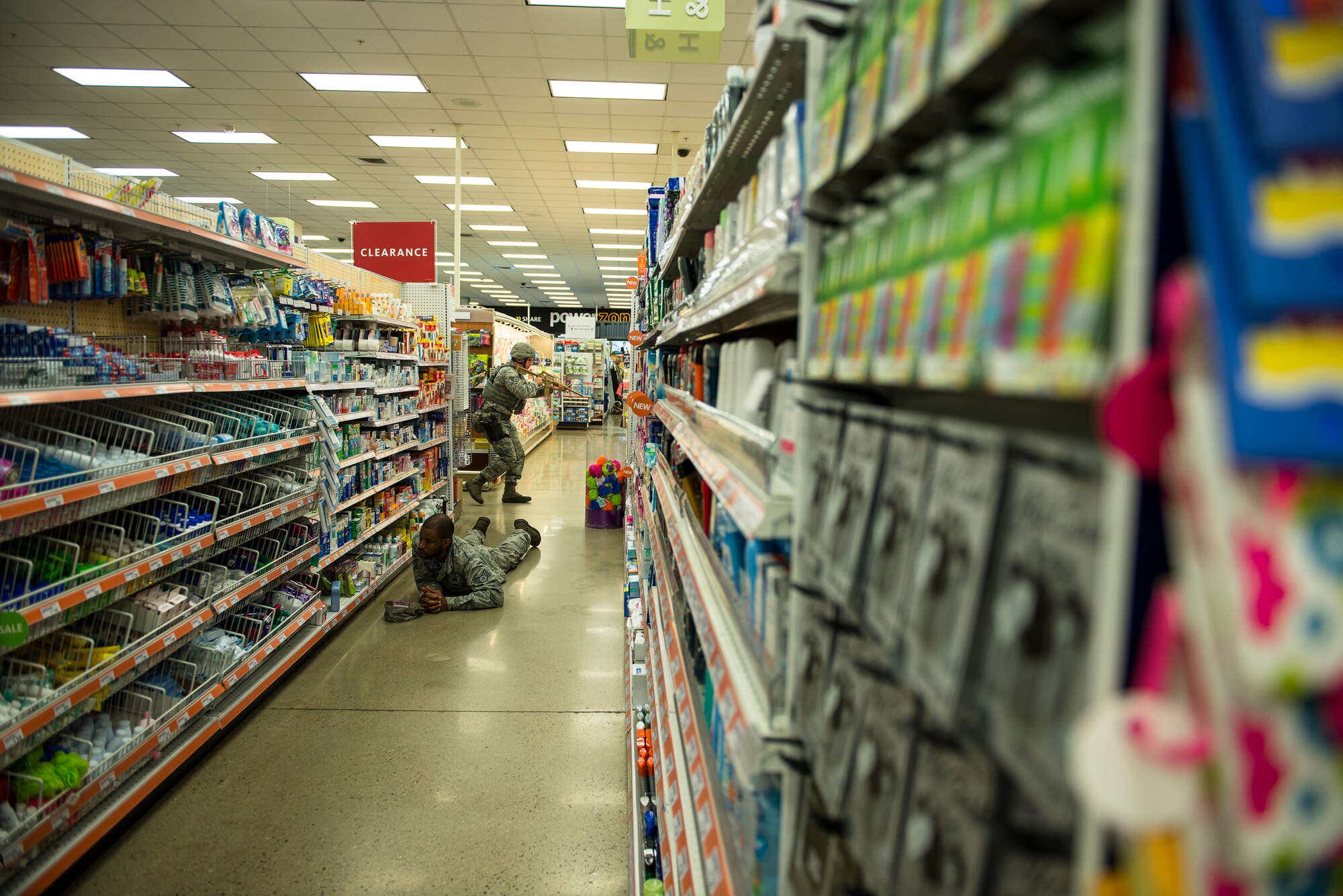 A 51st Security Forces Squadron responder sweeps the Base Exchange during an active-shooter exercise July 24, 2014, at Osan Air Base, Republic of Korea. The exercise tested emergency, recovery and defense personnel on their capablities to work through a disasterous situation. (U.S. Air Force photo by Staff Sgt. Jake Barreiro)